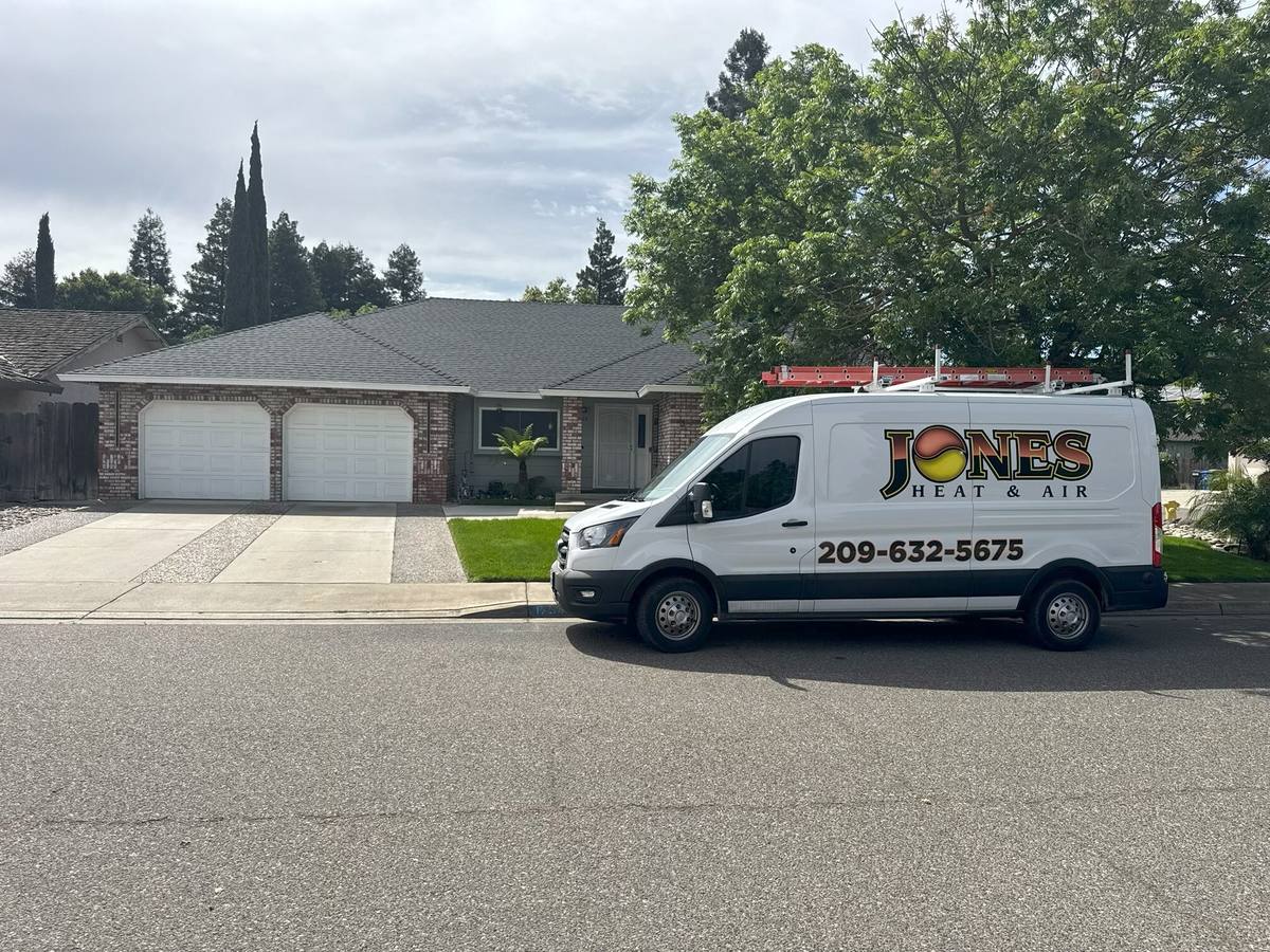 Jones Heat & Air service van in front of a Central Valley home