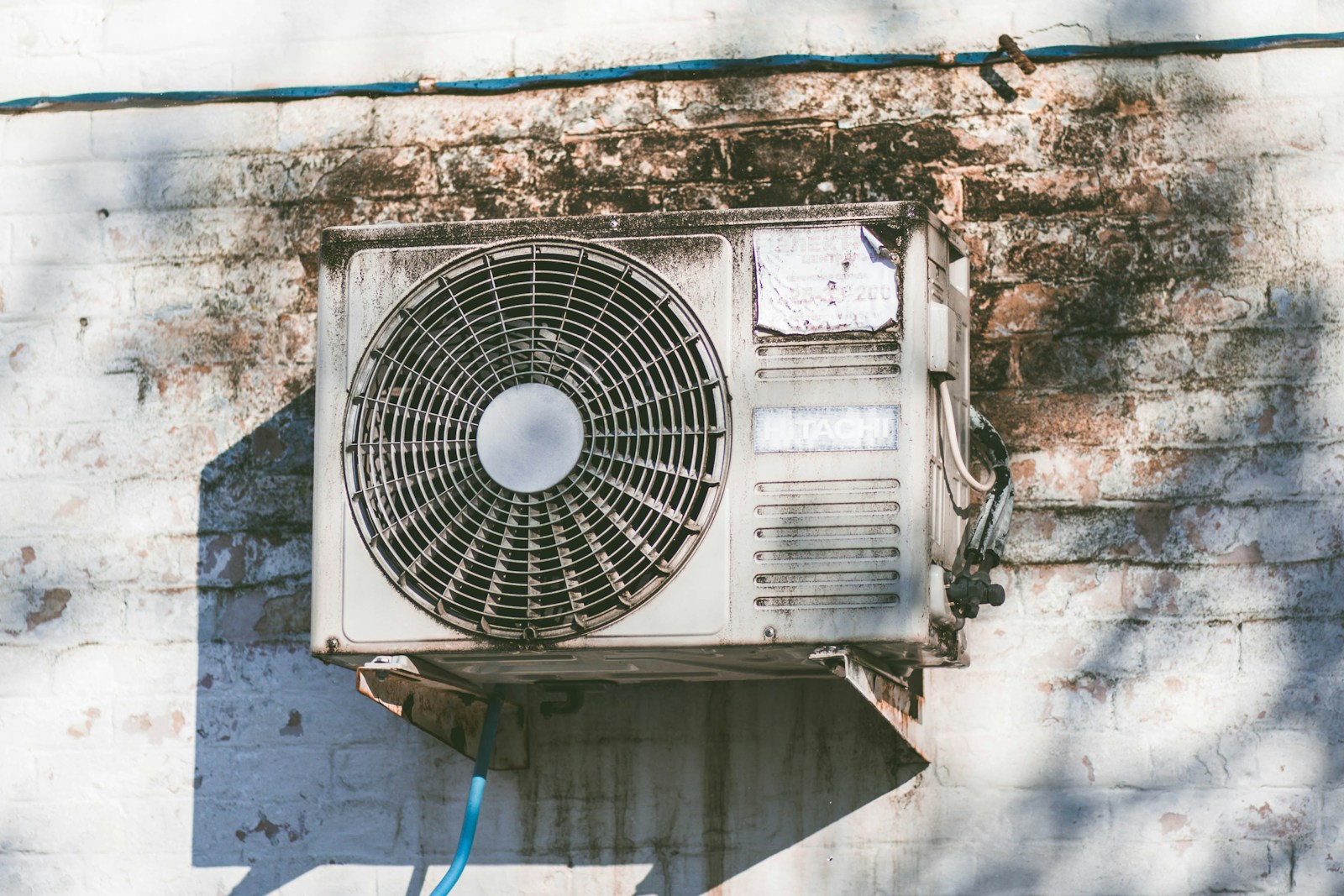 Technician servicing a residential HVAC heating system